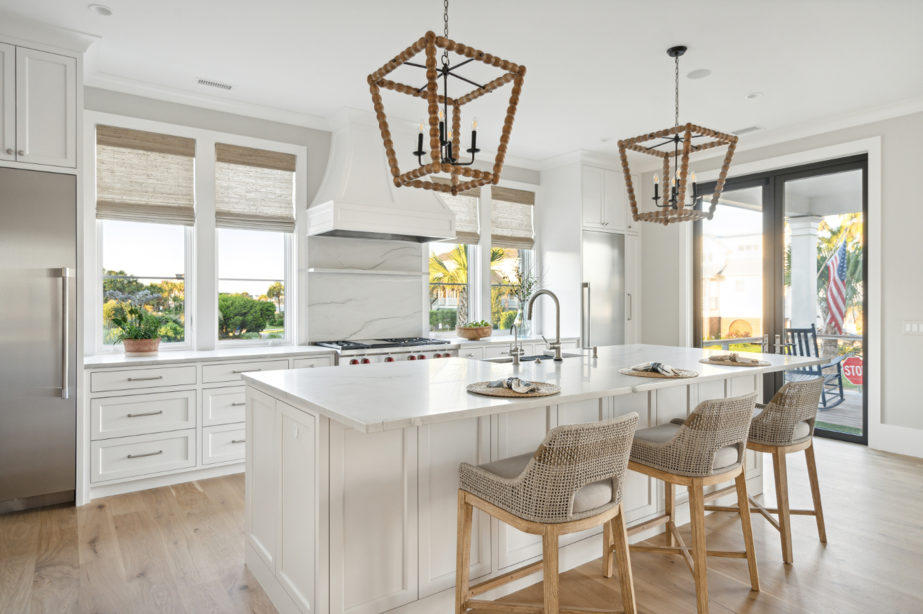 Saunders Wood Works — custom white kitchen with island and woven-bead pendants